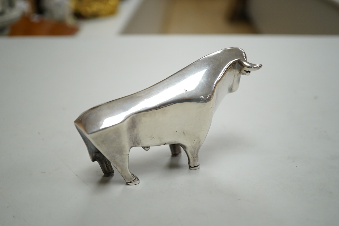 A stylised white metal (stamped 925) miniature model of a bull, length 11.5cm, height 7cm, 30oz.